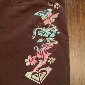 Brown Roxy shorts with pink and blue design